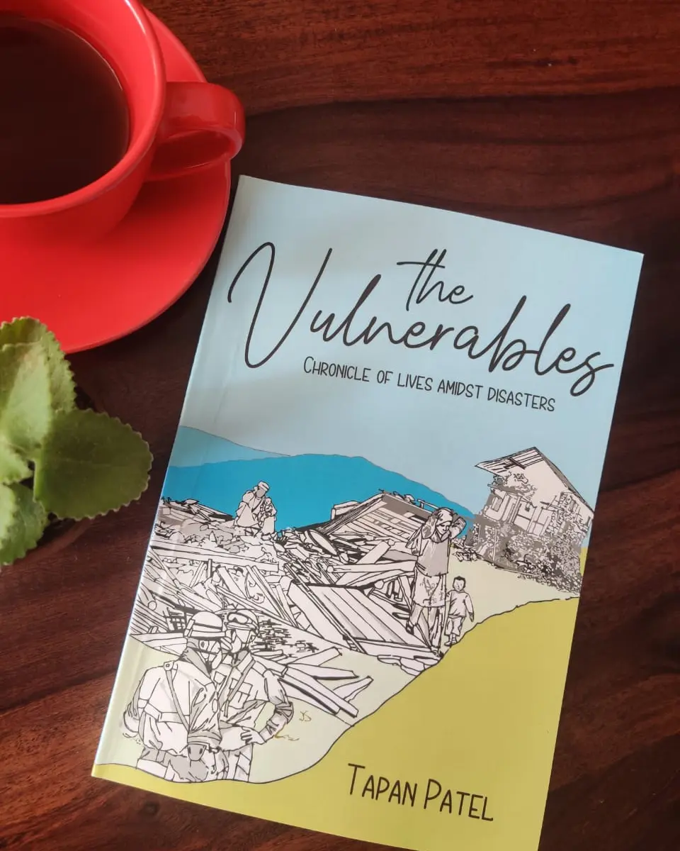 The Vulnerables by Tapan Patel beside coffee
