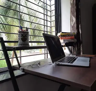 Books and a laptop on Tapan Patel's desk