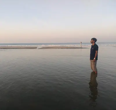 Tapan Patel standing at the shoreline